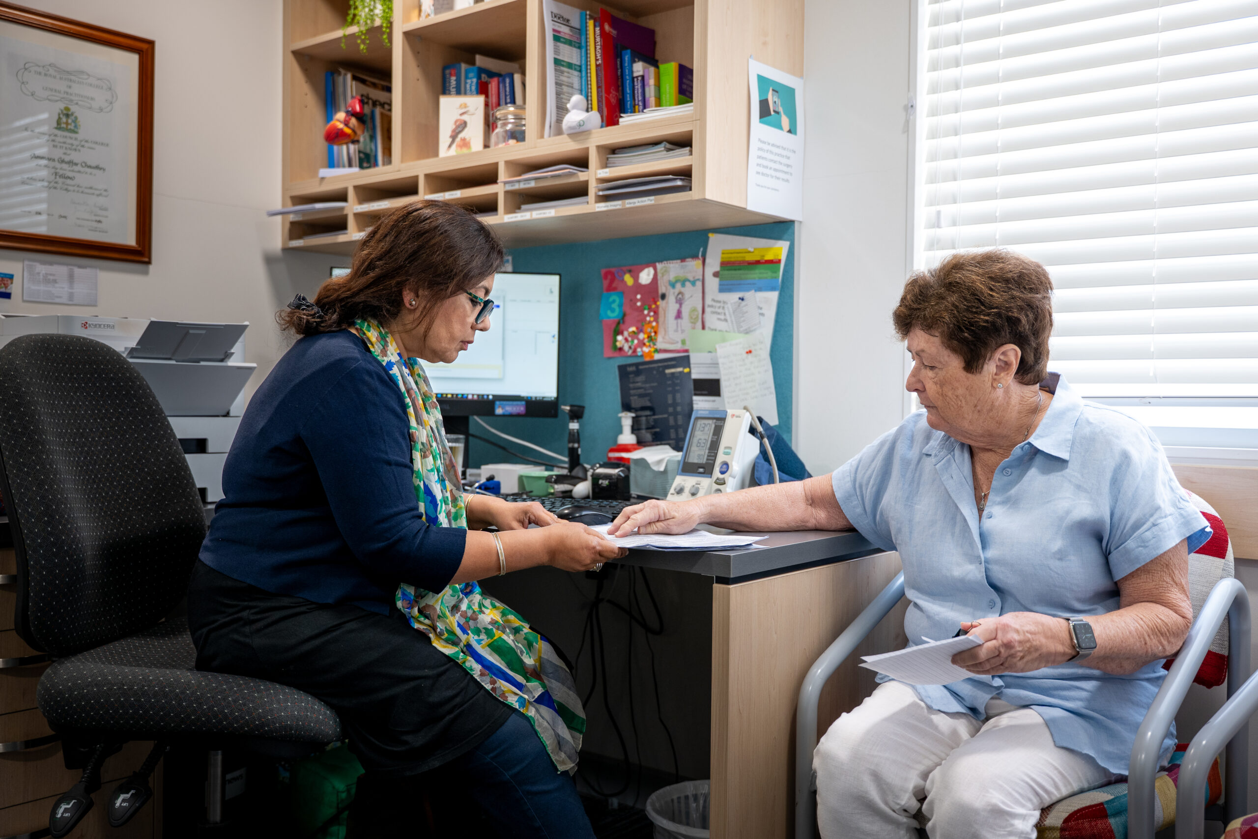 Dr Ammara Chaudhry reviewing test results with a patient at Samford Valley Medical Centre.